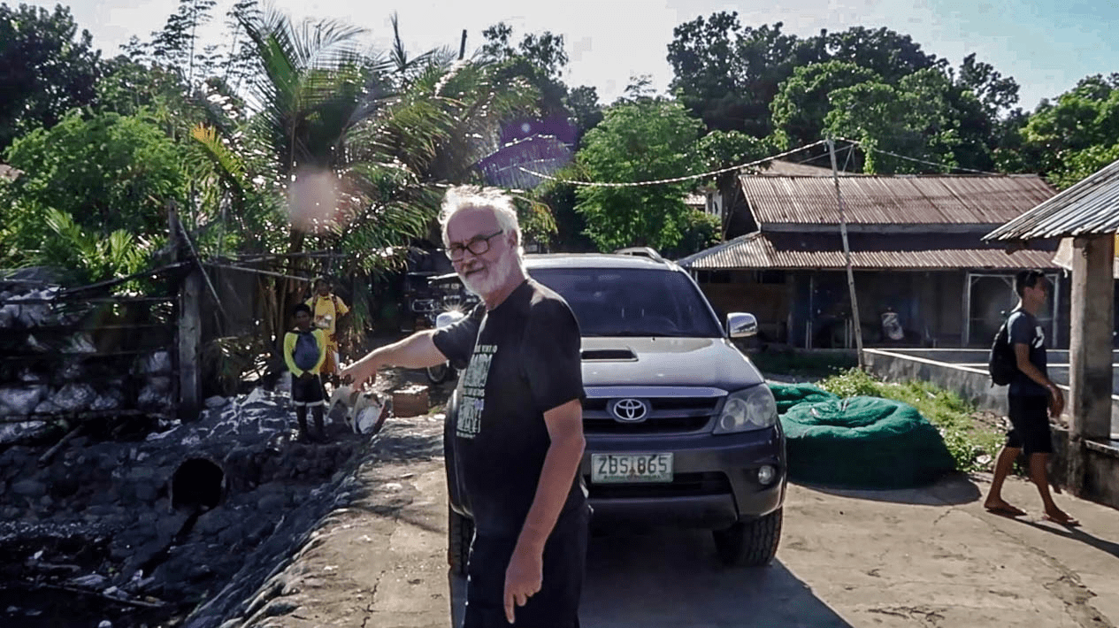 western man pointing finger in pangasinan philippines